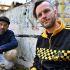 Members of Bosnian Hip-Hop band "Dubioza Kolektiv", Brano Jakubovic (L) and Vedran Mujagic pose with a ball in Sarajevo on June 2, 2026. With brass, guitars, and a music video overflowing with grilled meat, Bosnia has delivered the first World Cup anthem of 2026: "I Am from Bosnia, Take Me to America." the song had already accumulated several million views on different platforms. The song is a cover version of an earlier hit by the Bosnian rock band Dubioza Kolektiv and is rapidly becoming one of the signature songs (anthems) of the 2026 World Cup, which begins on June 11. (Photo by ELVIS BARUKCIC / AFP)
