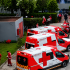Ambulancias, motocicletas y personal de Cruz Roja Mexicana concentrados en una sede operativa para atención prehospitalaria.