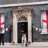 Chief Mouser to the Cabinet Office Larry the cat sitting in front of 10 Downing Street, London, decked out in St George's Cross flags ahead of England playing Argentina in the World Cup semi-final on Wednesday in Atlanta, USA. Picture date: Wednesday July 15, 2026.