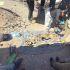 Peritos forenses examinando restos óseos recuperados de una fosa clandestina en Ciudad Juárez.
