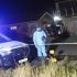 Personal del servicio forense trabaja en la zona donde fue asesinado el excampeón mundial Zolani Tete, en Mdantsane, Sudáfrica.