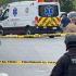 Elementos de la Guardia Estatal resguardan una zona acordonada en Reynosa, con una ambulancia y personal de emergencia en el lugar.