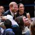 (FILES) Britain's Prince Harry (L), Duke of Sussex, and his wife Meghan (R), the Duchess of Sussex, meet people at the Royal Children's Hospital in Melbourne on April 14, 2026. Britain's Prince Harry and his wife Meghan will on Thursday, October 15, carry out their first joint engagement since returning to live in the UK in August, according to media reports. (Photo by William WEST / AFP)
