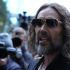 British comedian and actor Russell Brand arrives at Southwark Crown Court in south London on October 14, 2026, for the start of his trial. 51-year-old Brand faces seven sexual offence charges involving six women, relating to a period between 1999 and 2009. (Photo by Ben Stansall / AFP)