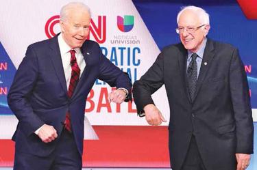 Biden y Sanders se confrontan por virus; debate demócrata