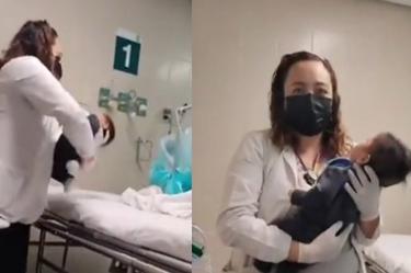 Enfermera con bebé al que le aplicaron vitamina A en gotas en ojos