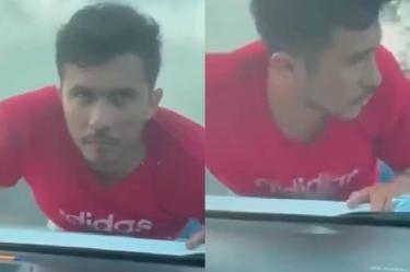 Ladrón se trepa a cofre de auto en Veracruz