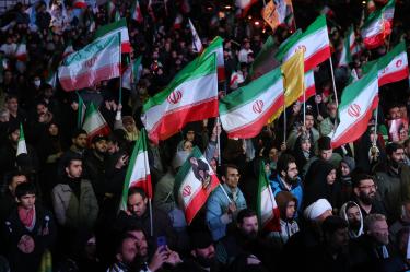 Iranians react after a ceasefire announcement at the Enqelab square, in Tehran, on April 8 2026. The United States and Iran agreed to a two-week ceasefire Tuesday barely an hour before US President Donald Trump's deadline to obliterate the rival country was set to expire, with Tehran to temporarily reopen the vital Strait of Hormuz. (Photo by AFP) /