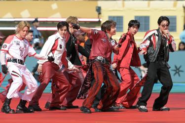 Members of the South Korean boy band BTS perform during the 2026 World Cup football tournament final match between Spain and Argentina at the New York/New Jersey Stadium in East Rutherford on July 19, 2026. (Photo by JUAN MABROMATA / AFP)
