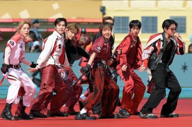 Members of the South Korean boy band BTS perform during the 2026 World Cup football tournament final match between Spain and Argentina at the New York/New Jersey Stadium in East Rutherford on July 19, 2026. (Photo by JUAN MABROMATA / AFP)