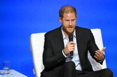 (FILES) Britain's Prince Harry, Duke of Sussex, speaks during the "Responsible Digital Future" forum in Bogota, Colombia, on August 15, 2024. Prince Harry and his wife Meghan, Duchess of Sussex, who cut ties with the British royal family in 2020, are moving back to the United Kingdom, British press reported on August 19, 2026. In a surprise move, the youngest son of King Charles III and Meghan, "plan to leave the United States by the end of the month to settle in a private, non-royal residence, which is said to be located outside London," The Telegraph said. (Photo by Raul ARBOLEDA / AFP)