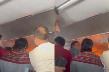 Un video muestra llamas en un compartimento superior del avión,