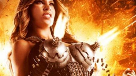 Sofía Vergara, de 40 años, aparece en medio de un halo de fuego, con gesto de furia y puños cerrados, armada con unas ametralladoras que le cubren los pechos y disparan a discreción.