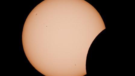 The moon partially covers the sun during a solar eclipse as seen from Arija, Spain, August 12, 2026. REUTERS/Borja Suarez